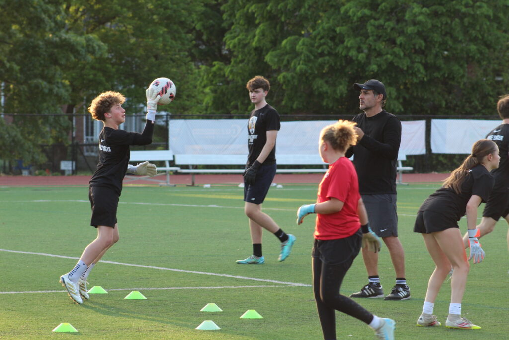 Felipe Quintero working with a goalkeeper during training